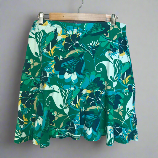 barefoot on the sand green skirt