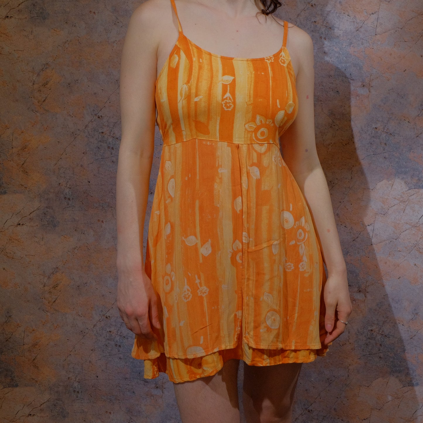 sunset and a vergina beer orange dress