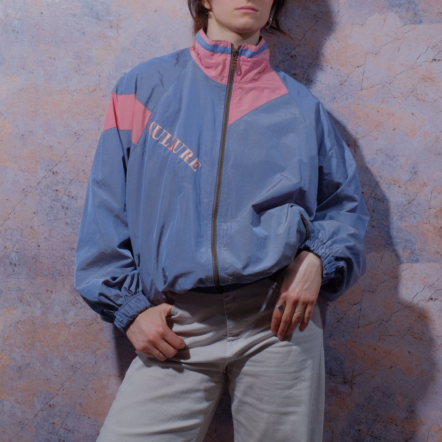 modernized marble statue gray jacket