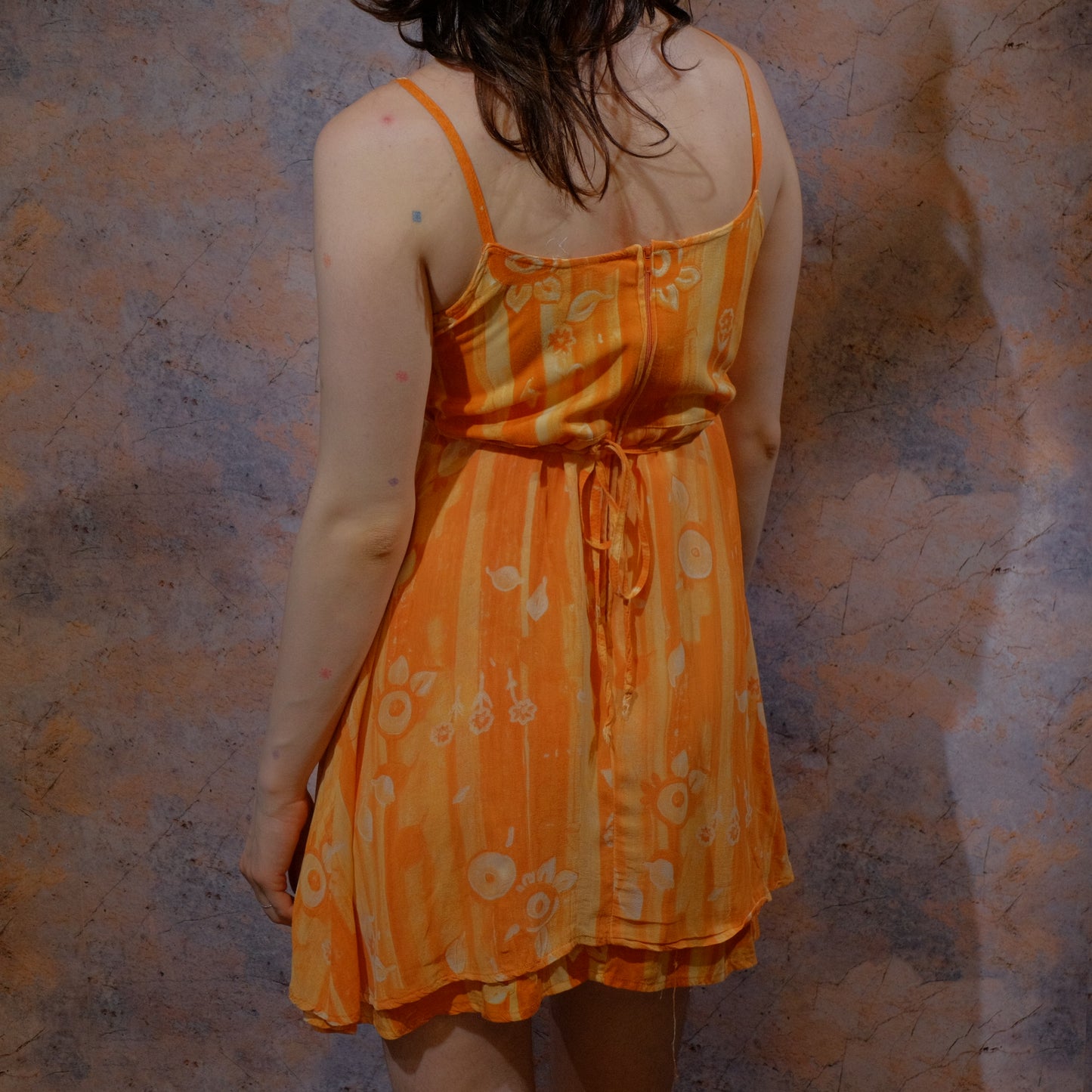 sunset and a vergina beer orange dress